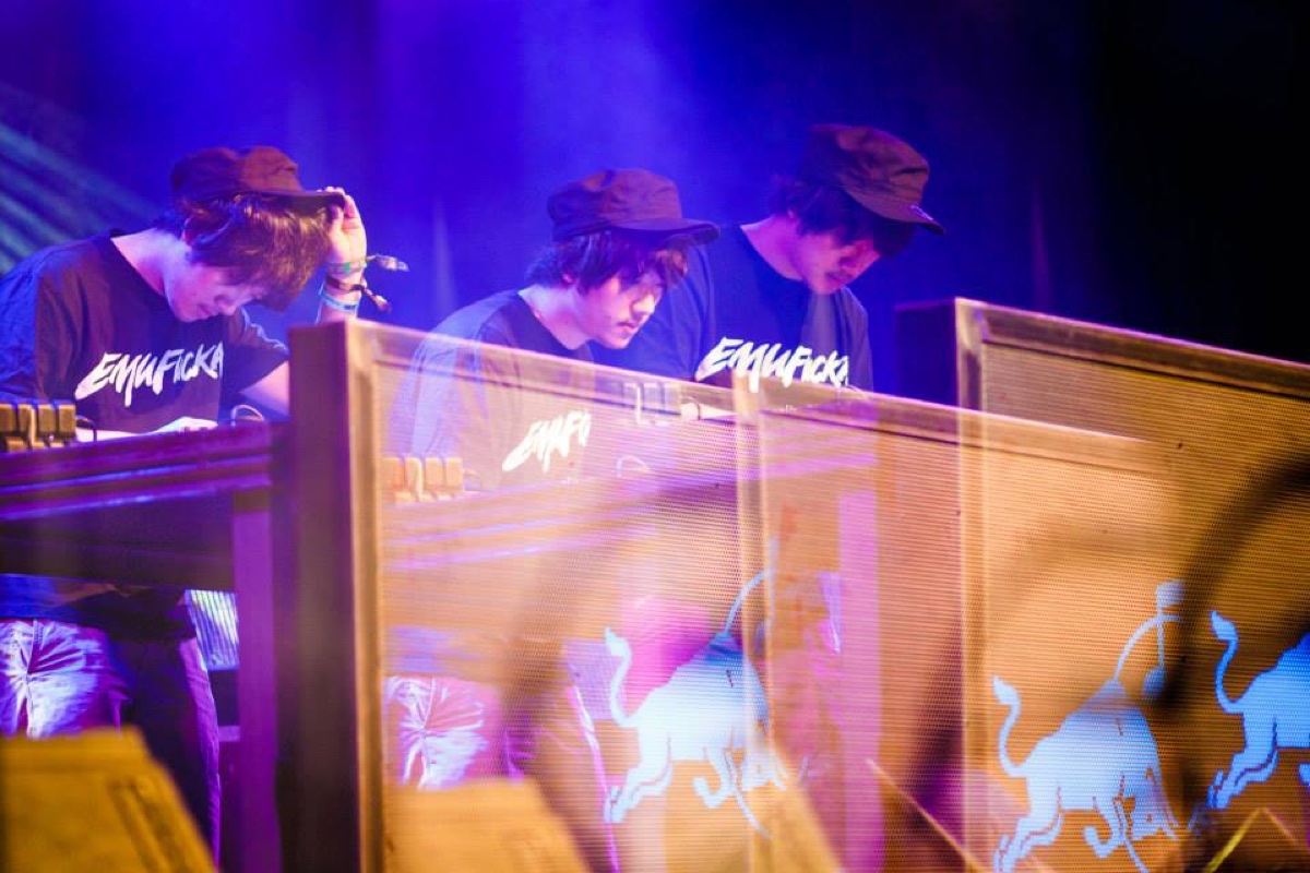 Multiple exposure image of Emufucka performing in purple stage light