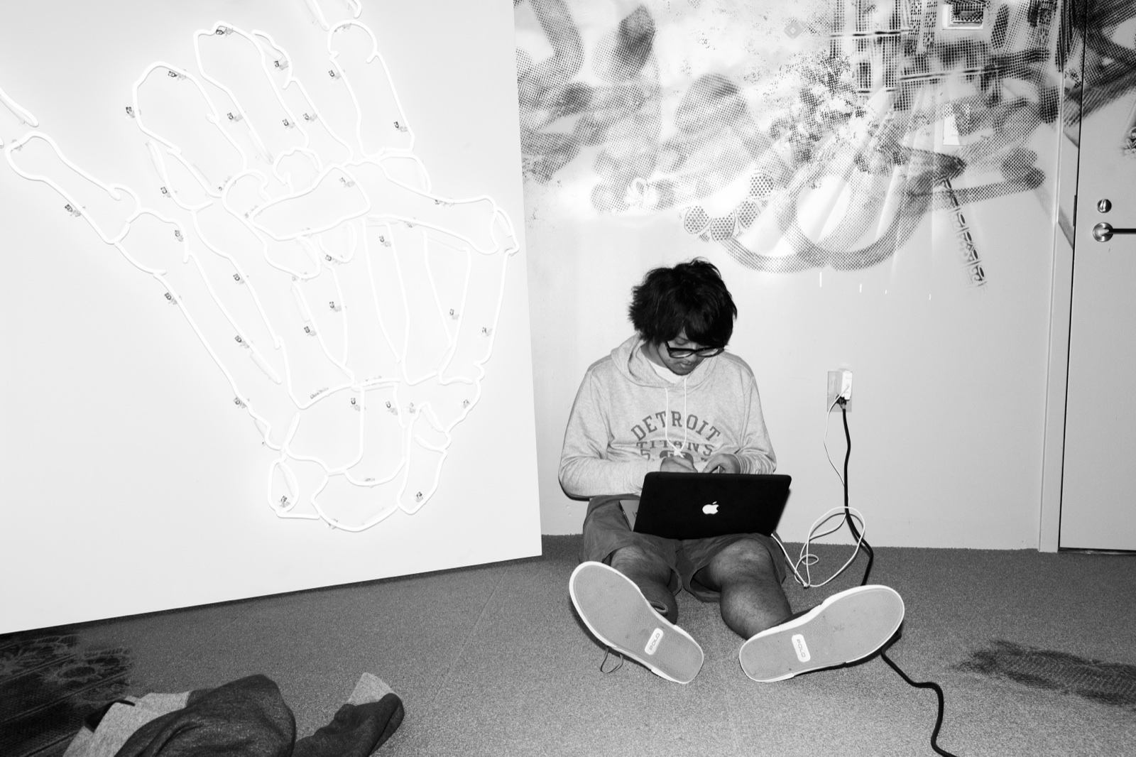 Emufucka sitting on the studio floor with a laptop during Red Bull Music Academy New York 2013