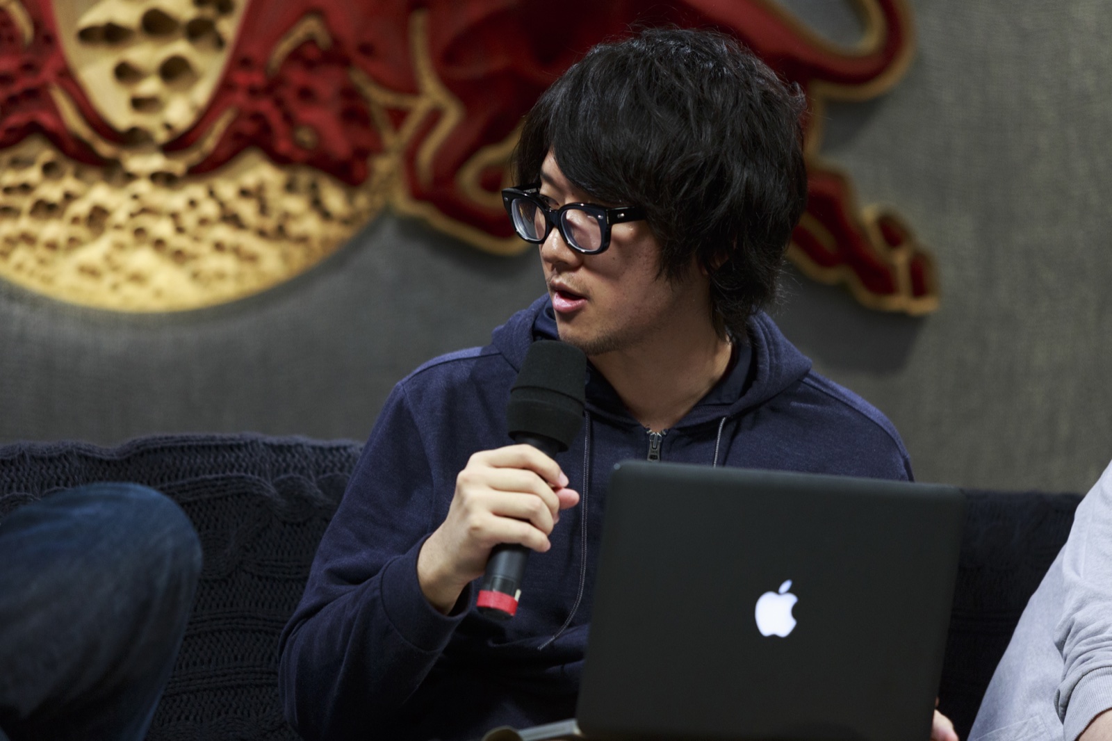 Emufucka speaking with a microphone during Red Bull Music Academy New York 2013