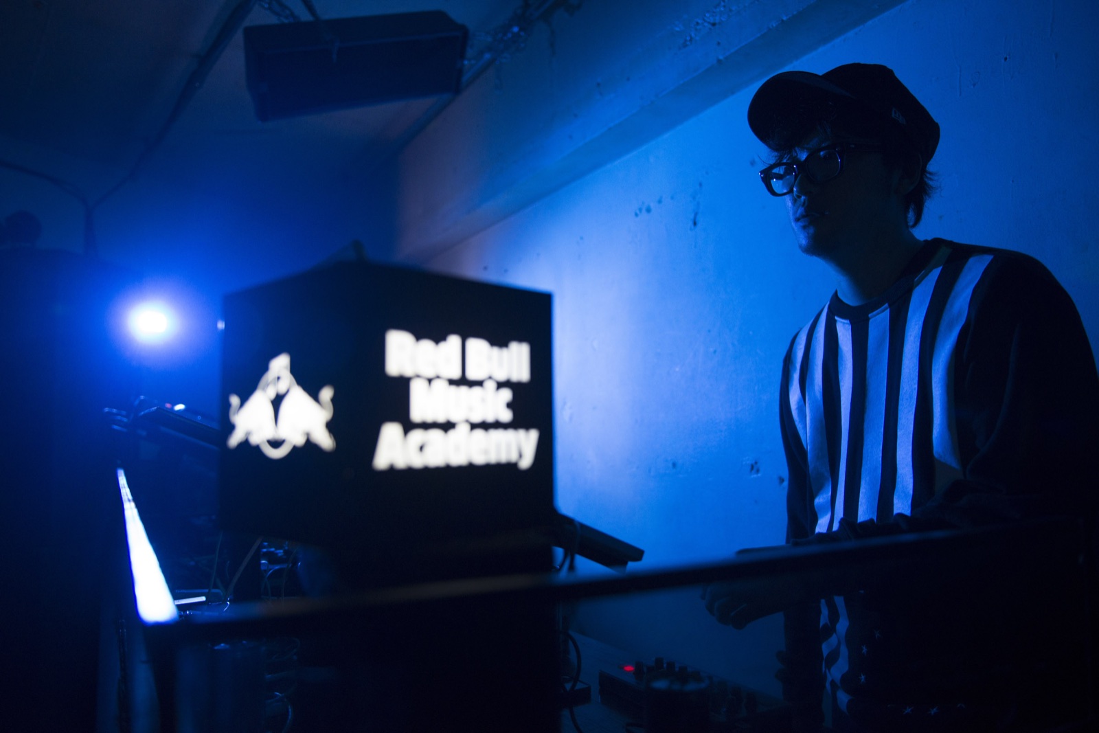 Emufucka performing in blue light at Red Bull Music Academy Tokyo 2014